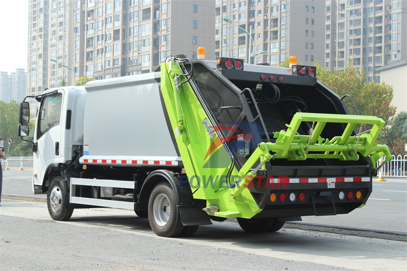 Isuzu truck with garbage compactor bodies